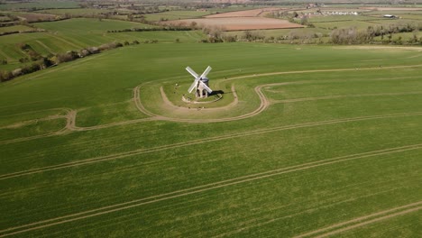 landmark chesterton historic windmill wide aerial view orbit right across english rural countryside farmland landscape