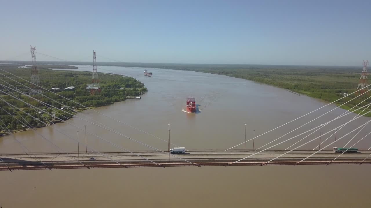 the cargo ship is sailing along the parn river. between the province of buenos aires and between rivers