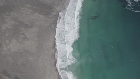 Aerial-view-above-the-Bunes-beach,-in-cloudy-Lofoten,-Norway---tracking,-overhead,-drone-shot