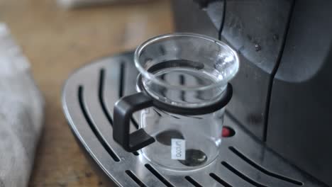 cinematic coffee: close-up video of coffee machine making a fresh cup of coffee