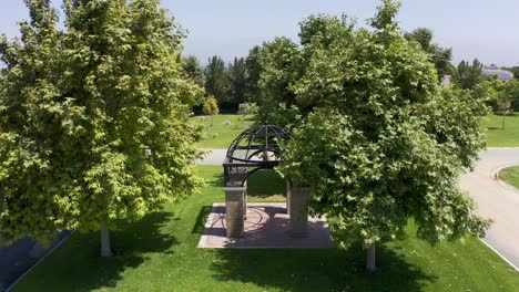 Reverse-pullback-close-up-aerial-shot-of-a-decorative-gazebo-at-a-mortuary-in-Southern-California