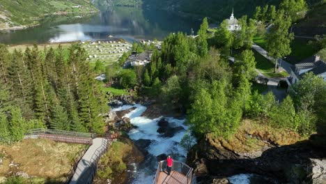 Person-on-river-platform-viewing-beautiful-Geirangerfjord,-Geiranger,-Norway