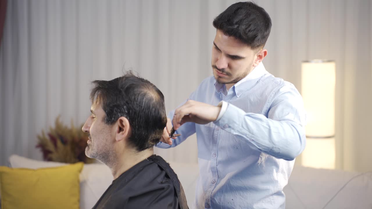 The son who cuts his father's hair.