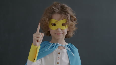 child dressed as superhero