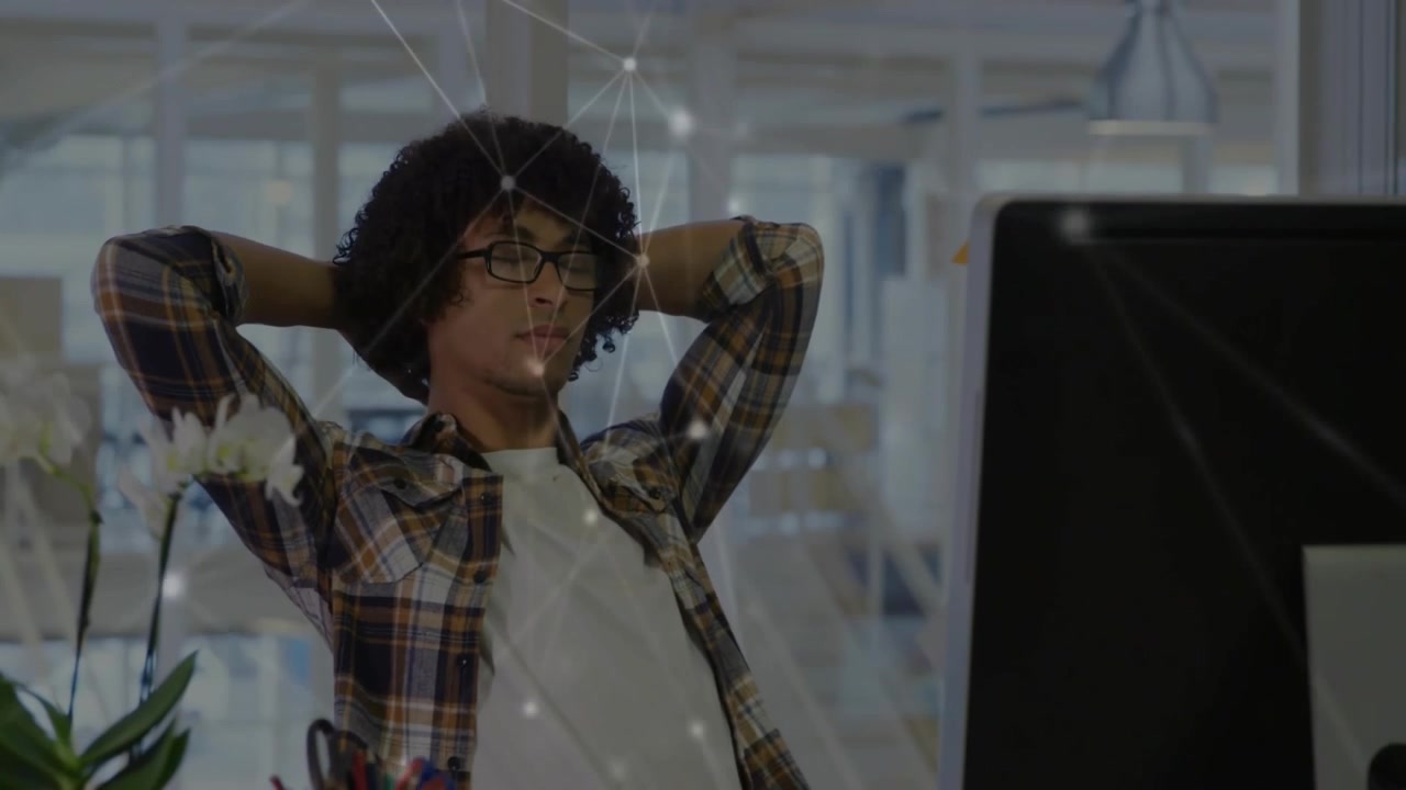 Tech worker pausing typing stretching to focus fixing specs resuming work as network overlay screen