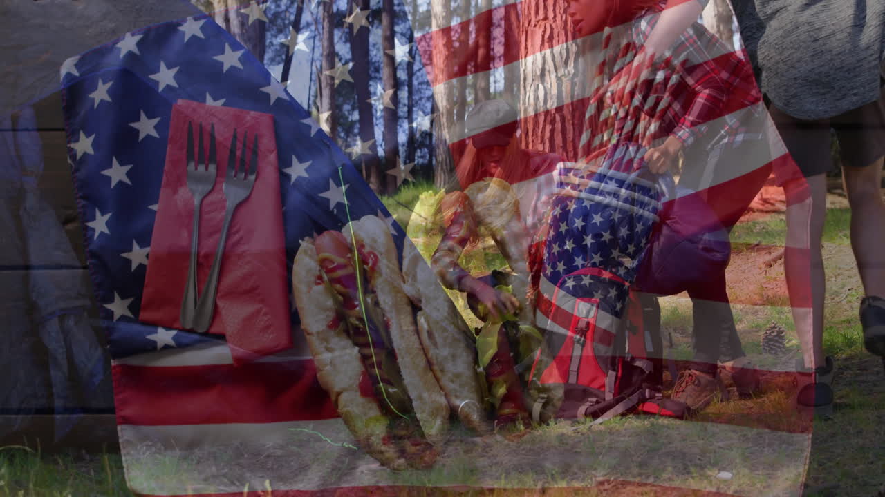 Overlaying American flag, people enjoying picnic with hot dogs outdoors in animation