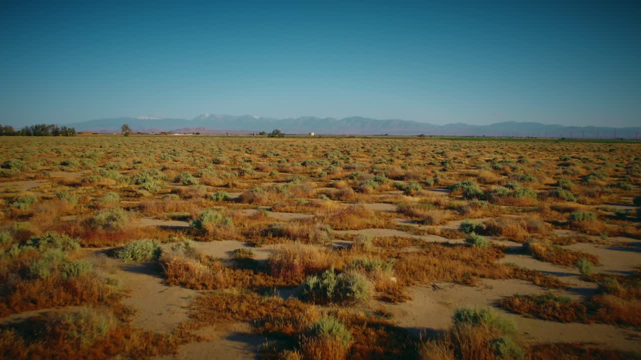 A slow, smooth zoom along the flat desert located in Northern California.