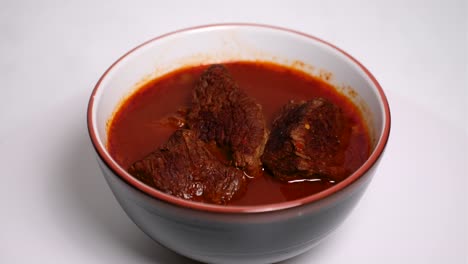 birria bowl without garnish on a lazy susan