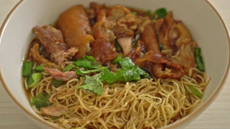 stewed pork leg noodles in brown soup