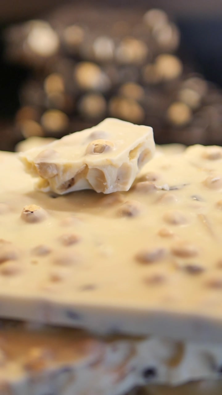 Close-up of White Chocolate Bar with Hazelnuts