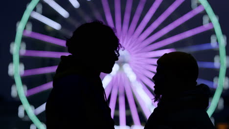 silhouette of happy couple kissing on street. man and woman enjoying date.