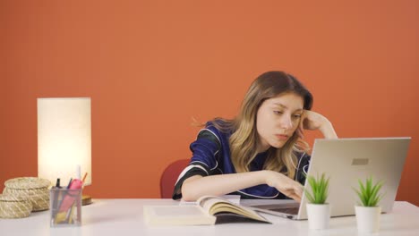 Tired-young-woman-at-laptop.