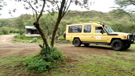 4x4 safari vehicle arriving in hell's gate national park, kenya, africa