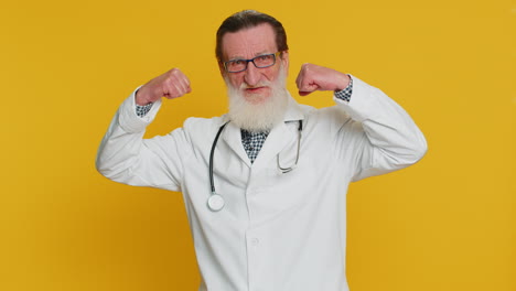 doctor man looking confident showing biceps, feeling power strength to fight for rights, success win