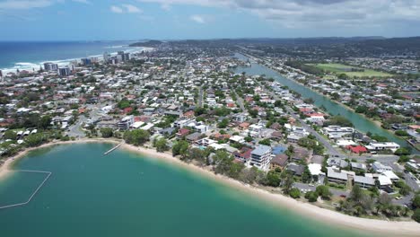 panoramic view of palm beach suburb and ocean coastline in gold coast, queensland, australia - drone shot