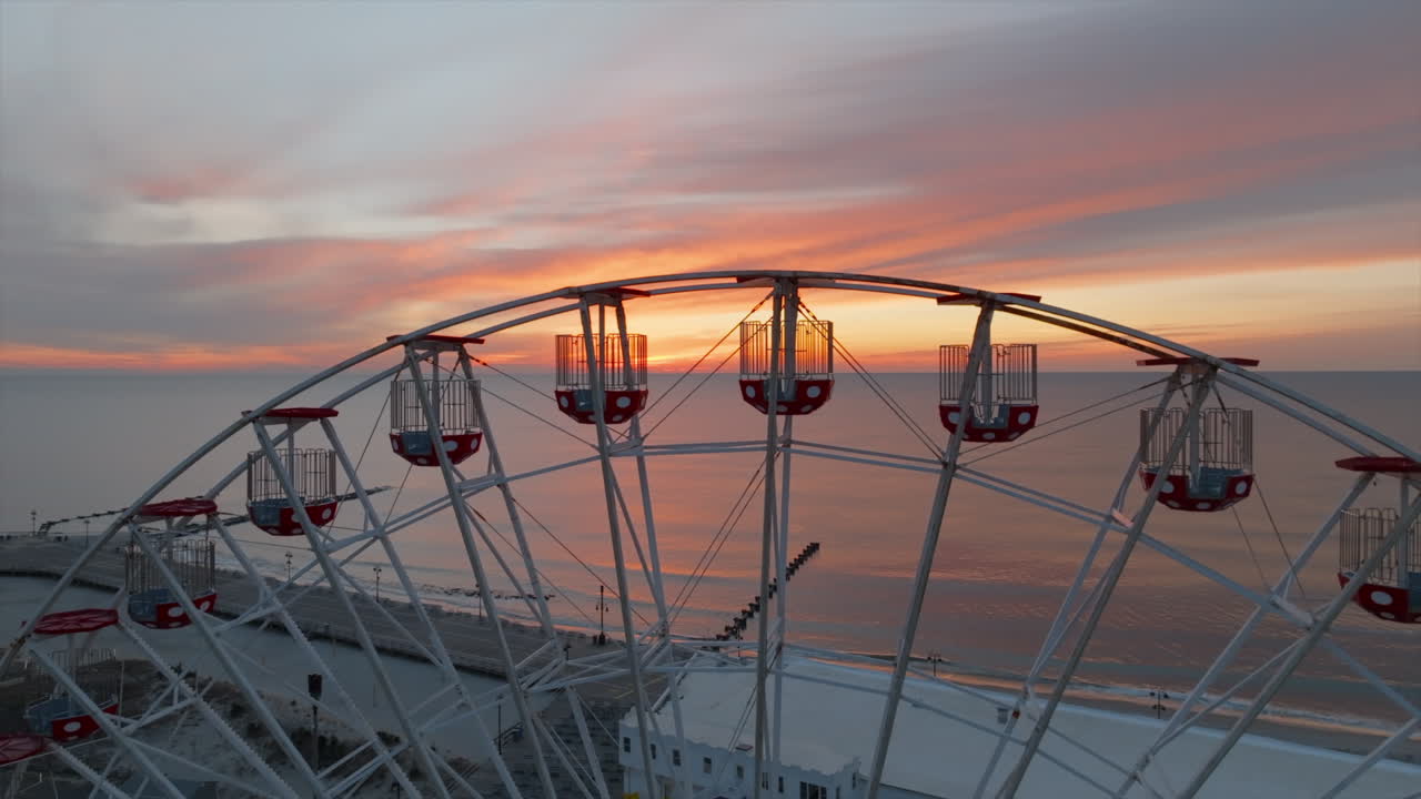 Ferris wheel at sunrise in Ocean City New Jersey boardwalk aerial