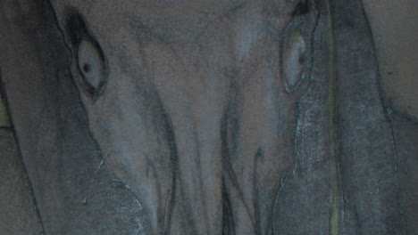 a close up of a tikbalang artwork. in filipino mythology, the tikbalang is part man, part horse hiding in the forest that is said to be of mischievous nature.
