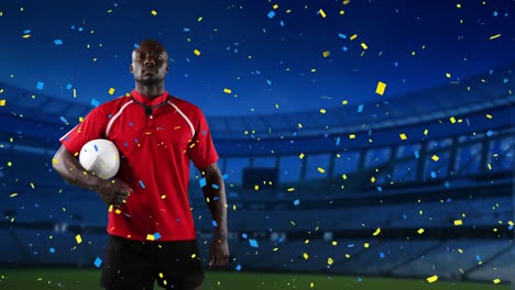 professional rugby player standing in front of a stadium with confetti falling