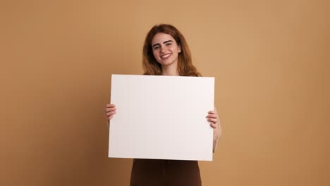 happy young woman gesturing at white blank sheet