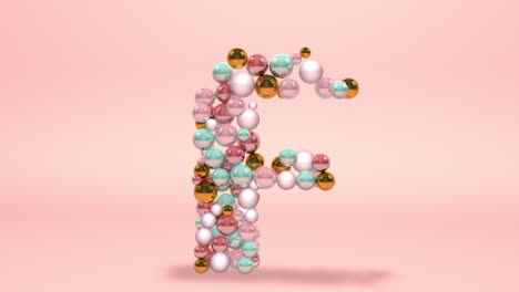 letter f made of beads, glass balls, pastel pearls, crystal jewels and gold