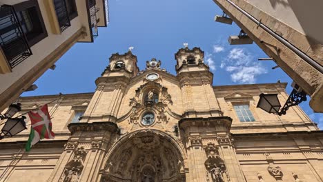 tilt up the ornate stone facade of san sebastian basilica in spain