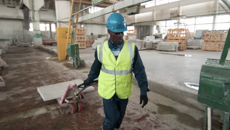 man transporting marble piece