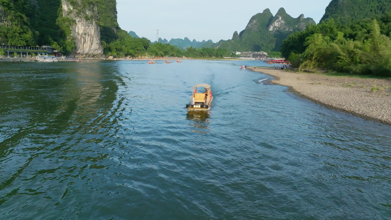 Aerial view of a bamboo raft on the Lijiang river, summer day in Yangshuo, China