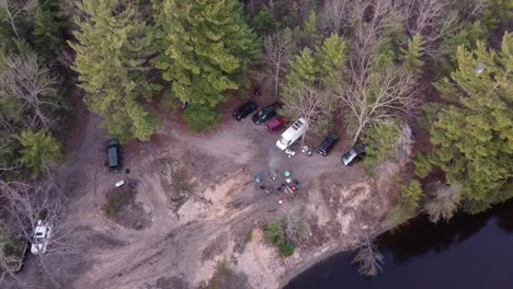 vehicles park at lakeshore in leota, michigan for overlanding camping