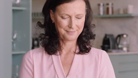 happy-mature-woman-using-laptop-at-home-browsing-online-enjoying-reading-social-media-messages-on-computer