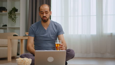 zoom in shot of angry man on a video call