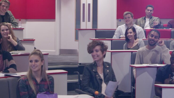 Happy students in the audience at a university lecture, shot on R3D