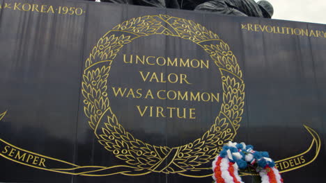 slow motion dolly on the inscription of the us marine corp war memorial