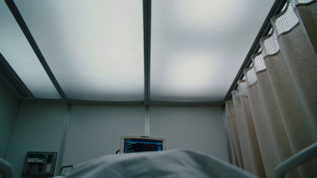 Detecting vitals, monitor recording while supine adult breathing under blanket in ward bed
