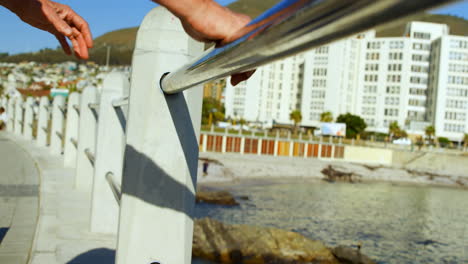 Senior-man-standing-near-railing-at-promenade-4k