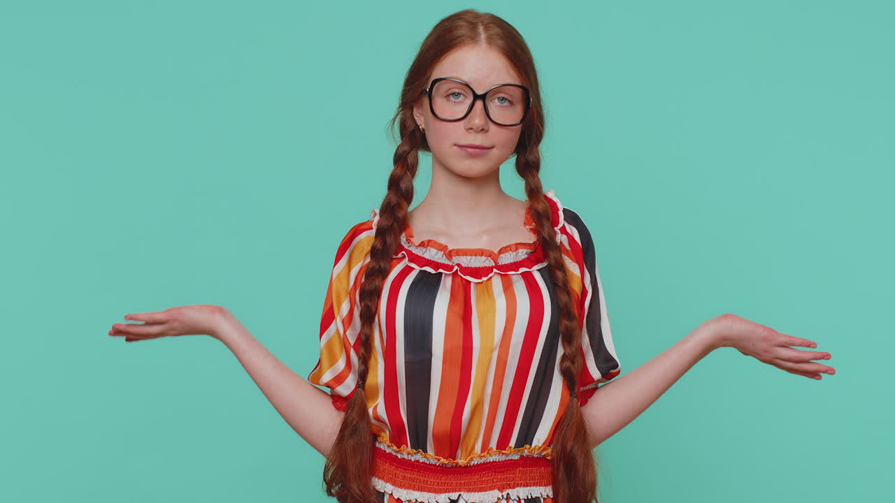Confused redhead girl feeling embarrassed about ambiguous question, having doubts, no idea, clueless