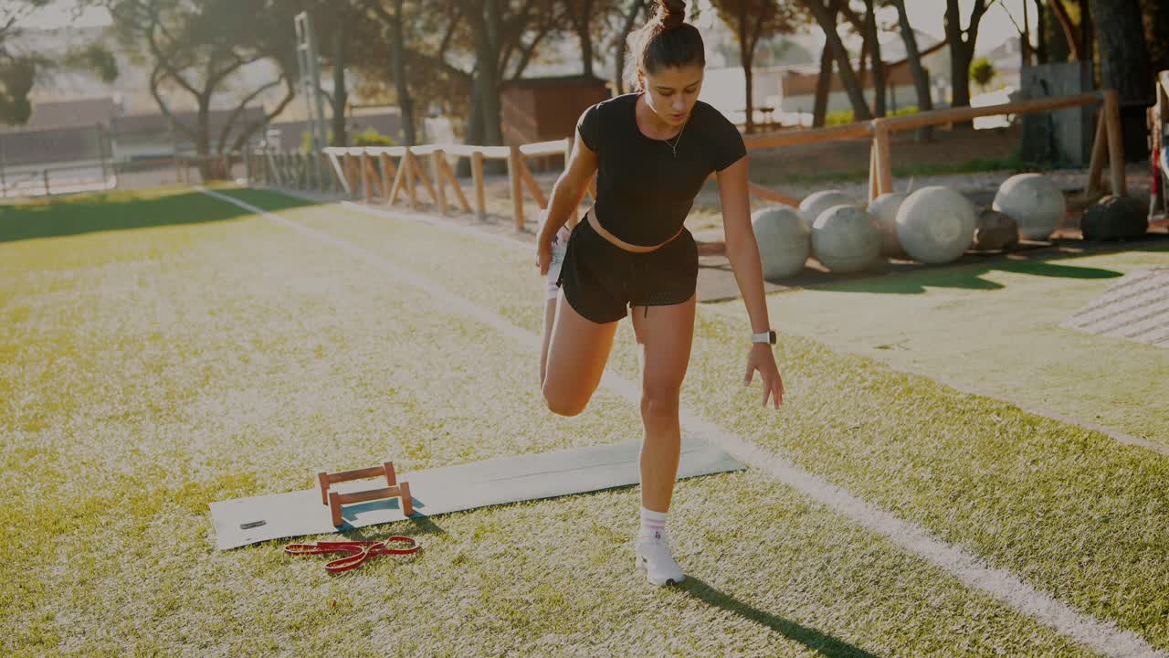 Woman Stretching on Yoga Mat Outdoors