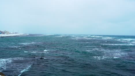 waves breaking in winter storm in northern hokkaido