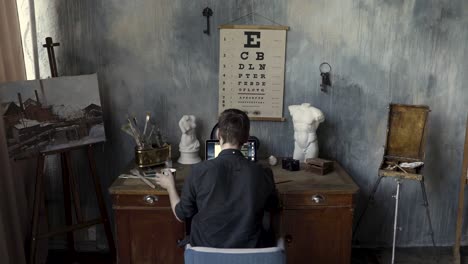 artist working in a vintage studio