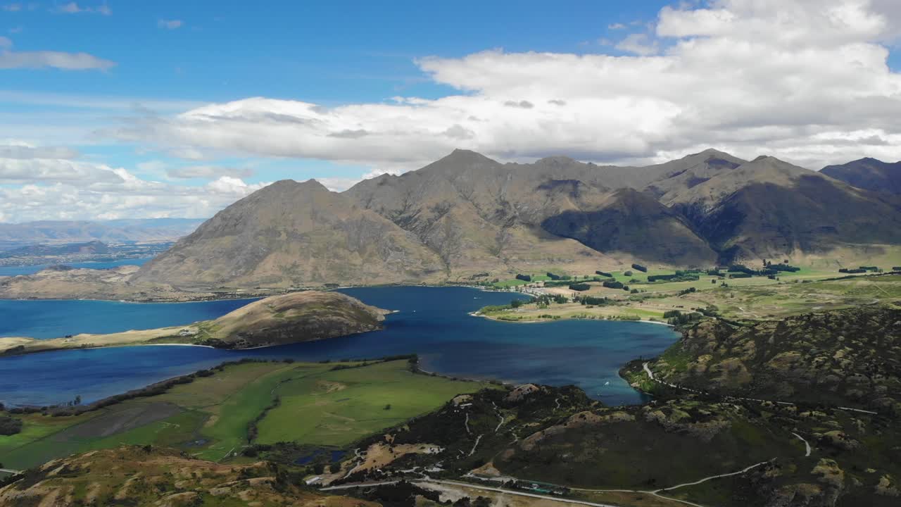 Aerial pan of Roy's Peak mountain and beautiful Lake Wanaka, New Zealand