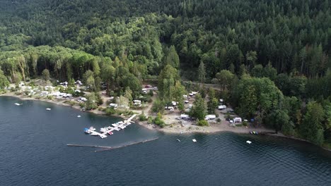 aerial view of a campground and pier by sproat lake, vancouver island