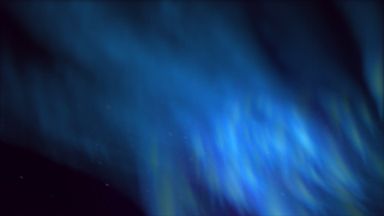 A striking blue aurora borealis illuminates the polar sky. This mesmerizing natural light show results from solar wind particles interacting with Earth's magnetic field