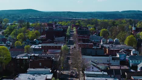 this is a mavic 3 pro drone shot using the 70mm lens of beacon, ny's main street with the newburgh-beacon bridge in the background