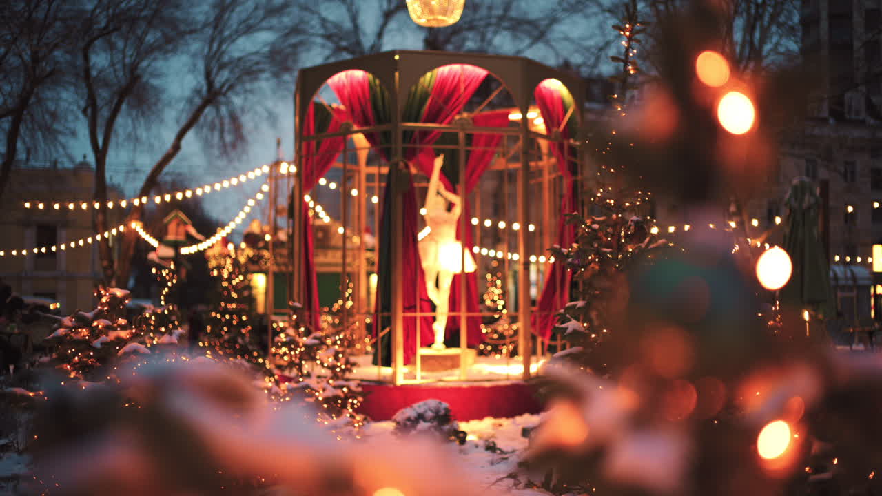 Wide view of a festive Christmas decoration with lights, at an outdoor cafe near small trees, and ornaments
