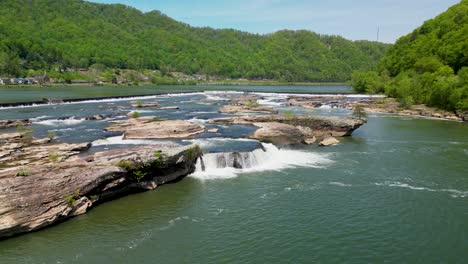 aerial reveal of kanawha falls and rock formations along river, west virginia