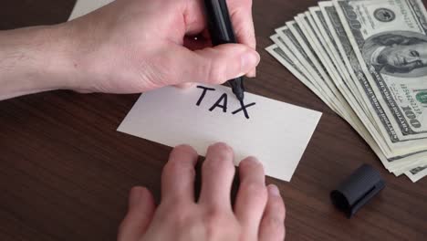 writing the word "tax benefits" on a piece of paper