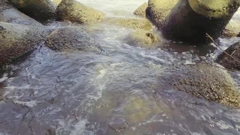 sea water barrier stone at the pier during the day