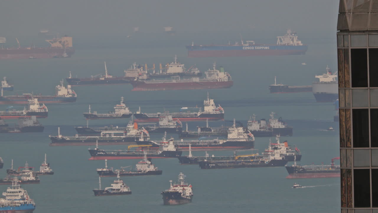 SINGAPORE - 5 MARCH 2025 : container ships waiting in the sea by singapore