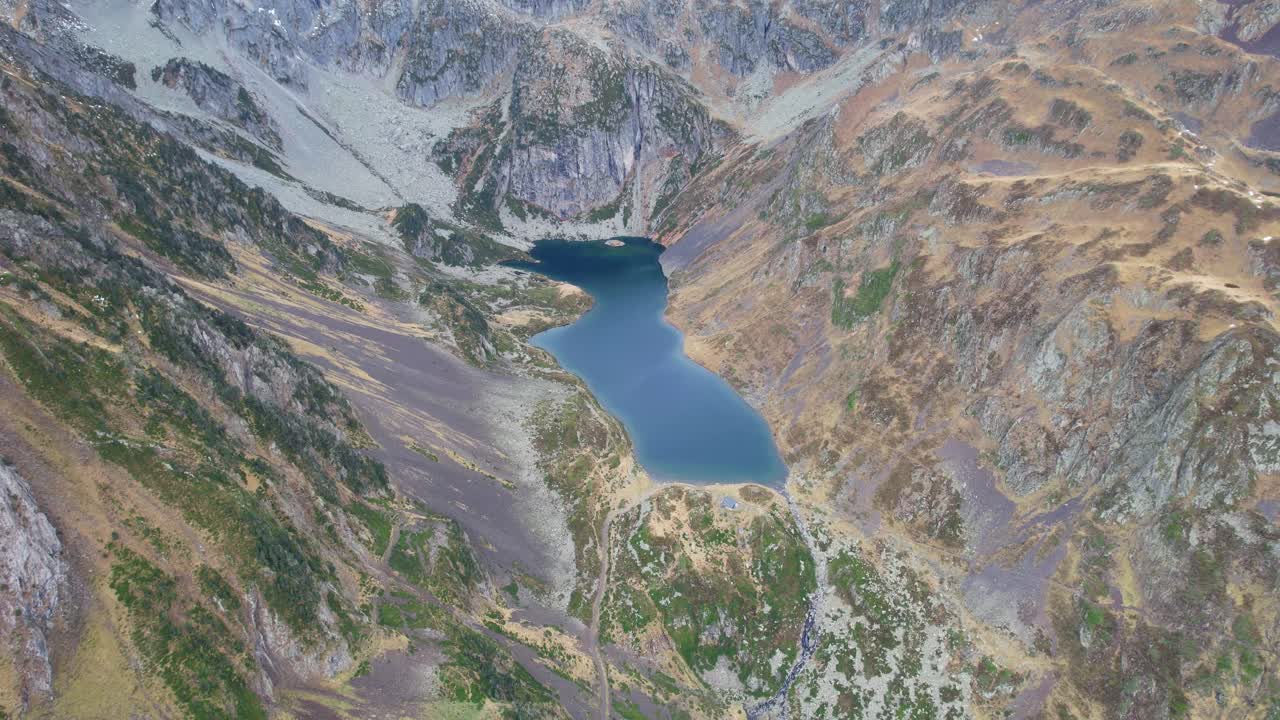 Aerial view of tranquil Ilhéou Lake in Pyrenees, France, ideal for hiking