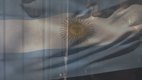 Animation-of-flag-of-argentina-over-caucasian-male-soldiers-using-rifle