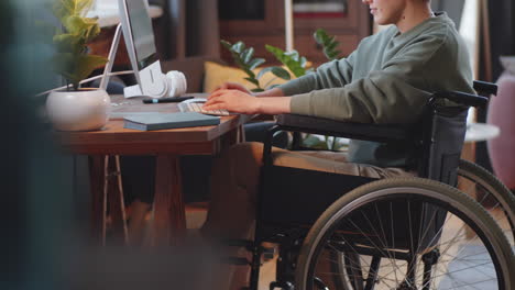 young person using computer in wheelchair